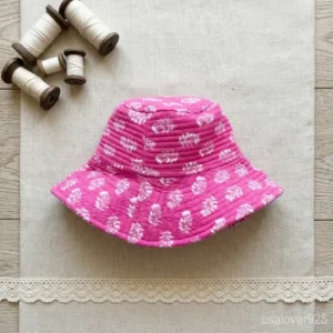 Reversible side of the Pink Block Print Quilted Cotton Bucket Hat showing solid color style.