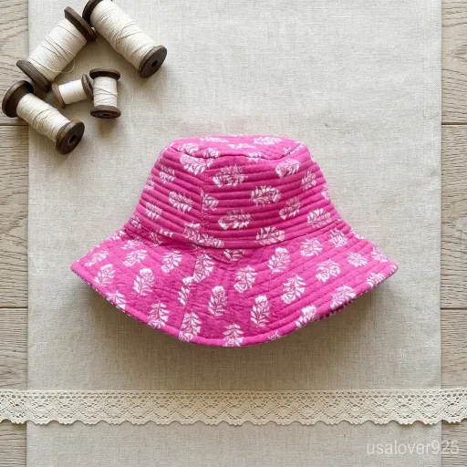 Reversible side of the Pink Block Print Quilted Cotton Bucket Hat showing solid color style.