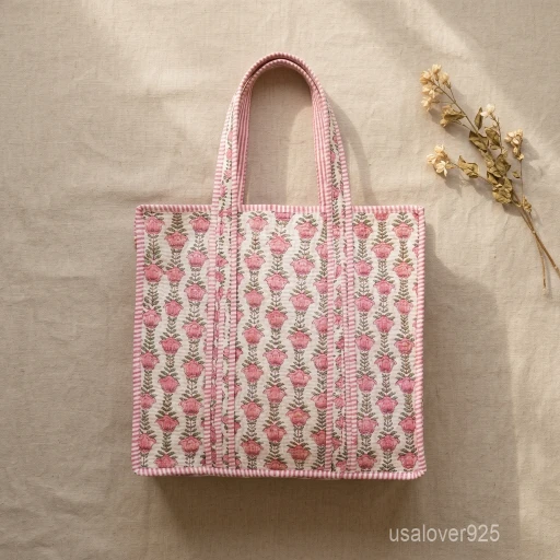 Pink Floral Quilted Tote Bag showing the traditional hand block print artisan design with the spacious main compartment opening and reinforced double shoulder handles.