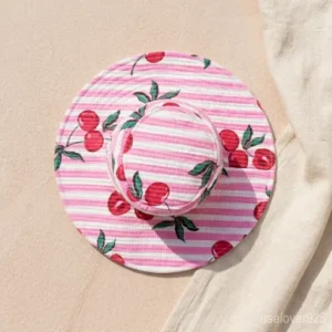 Woman wearing a Pink Floral Quilted Cotton Bucket Hat at a summer garden party.