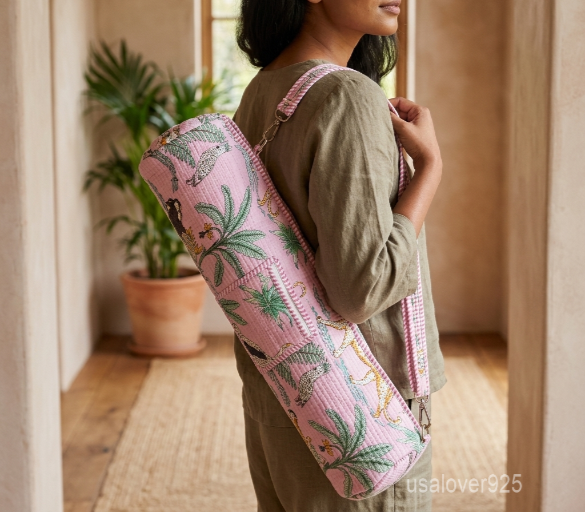 Woman walking to a workout studio carrying a Pink Floral Quilted Cotton Yoga Mat Bag comfortably as a crossbody sling.