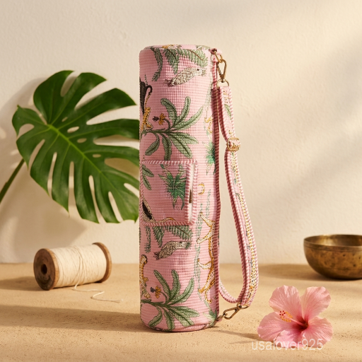 Close-up of the convenient integrated front pocket, top closure system, and premium quilted stitching on a pink floral cotton yoga bag.