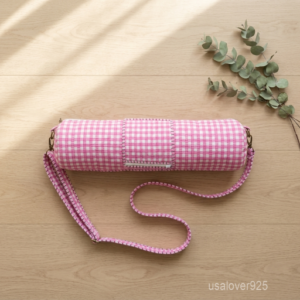 Pink Gingham Yoga Mat Carrier showing the traditional checkered artisan design with the full-length zipper closure and outer pocket.