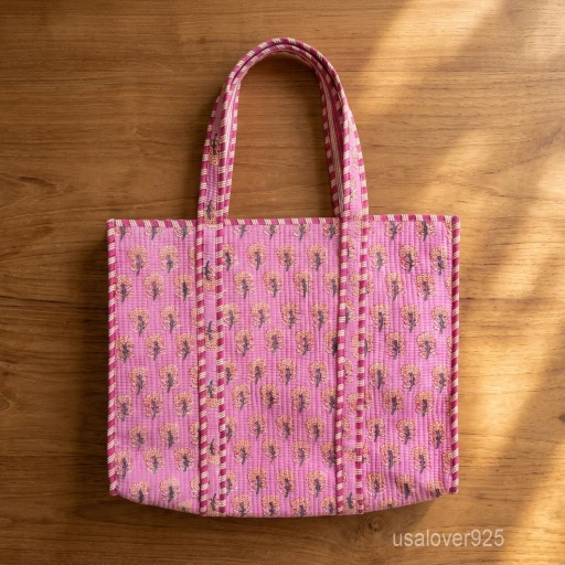 A person carrying a large Pink Indian Floral Quilted Cotton Tote Bag comfortably over their shoulder during a casual weekend travel trip.