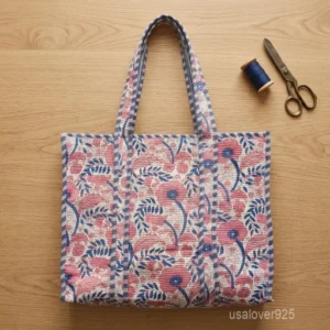 Pink and Blue Floral Quilted Cotton Tote Bag with wide shoulder straps showing the unique wide-profile horizontal design.