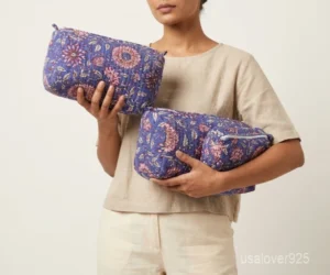 Close-up of the handcrafted purple floral print detailing, dense quilted stitching rows, waterproof internal plastic lining, and built-in 4 inside slots on an Indian cotton cosmetic caddy pouch.