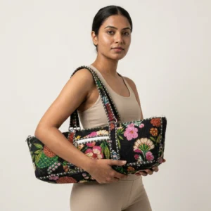 Black Floral Quilted Yoga Mat Bag showing the traditional hand block print artisan design with the spacious duffle-style opening and comfortable shoulder carry handles.