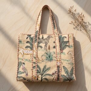 A shopper carrying the Jungle Print Quilted Cotton Tote Bag by the wide straps, showcasing its generous packing capacity and vibrant bohemian accessory style at an outdoor market.