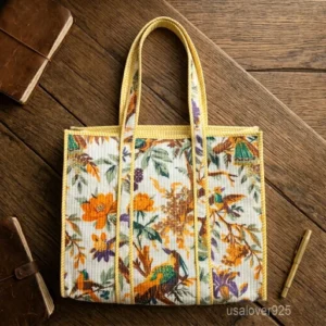 A person carrying a large Quilted Cotton Tote Bag with Artisan Pattern Prints comfortably over their shoulder during a weekend getaway beach trip.