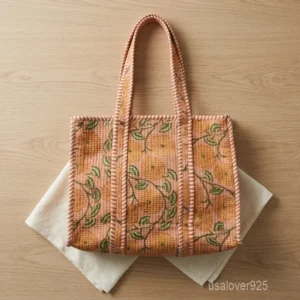 A person carrying a Quilted Floral Block Print Cotton Tote Bag comfortably over their shoulder during a daily market visit.