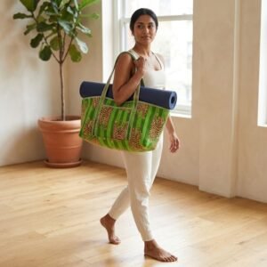 A fitness enthusiast carrying the Green Tiger Quilted Yoga Tote Bag over the shoulder by the wide straps, showcasing its long profile and classic bohemian accessory style while heading to a yoga studio class.