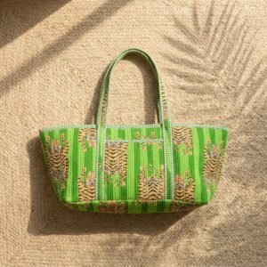 Close-up of the handcrafted green tiger print detailing, dense quilted stitching texture lines, robust handle strap attachments, and neat interior pocket slot on an Indian cotton Pilates carrier bag.