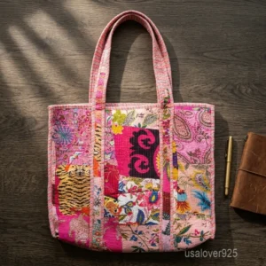 A person holding a large Quilted Patchwork Print Cotton Shoulder Tote Bag comfortably by its handles during a weekend travel getaway.