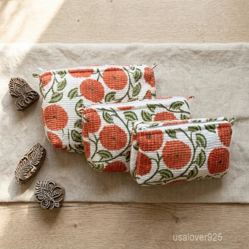 Set of 3 Red Block Print Quilted Cotton Toiletry Bags nesting set showing the traditional crimson artisan design and secure zipper lines with accent beads and tassels.