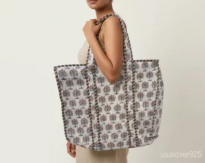 Close-up of elegant red and grey botanical print patterns and high-quality quilted stitching on a Red Grey Floral XL Quilted Cotton Tote Bag.