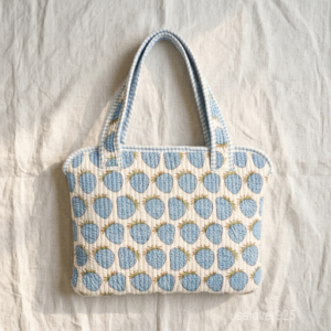Sky Blue Strawberry Laptop Sleeve showing the traditional hand block print artisan design with the smooth zipper closure and double carry handles.