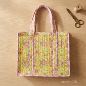 Sunflower Quilted Tote Bag showing the traditional hand block print artisan design with the top zipper closure and contrasting pink striped shoulder handles.