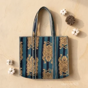 A person carrying a large Tiger Print Quilted Cotton Tote Bag comfortably over their shoulder during a casual weekend market run.