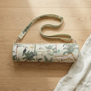 Close-up of the convenient integrated exterior pocket, top closure system, and premium quilted stitching on a wild cat print cotton yoga bag.