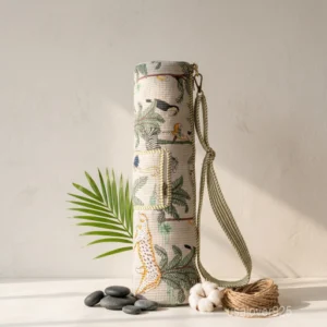 Woman walking to a fitness class carrying a Tropical Animal Print Quilted Cotton Yoga Mat Bag comfortably as a crossbody sling.