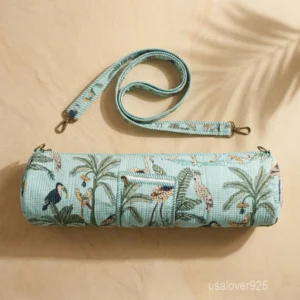 Close-up of the convenient integrated front pocket, top closure system, and premium quilted stitching on a tropical jungle print cotton yoga bag.