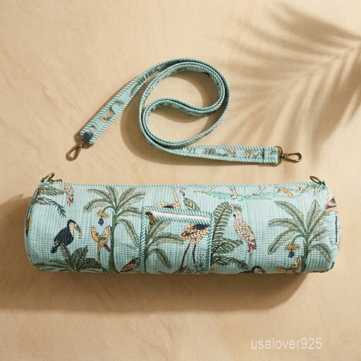 Close-up of the convenient integrated front pocket, top closure system, and premium quilted stitching on a tropical jungle print cotton yoga bag.