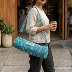 Turquoise Floral Yoga Mat Bag with an adjustable shoulder strap showing the vibrant turquoise and white block print.