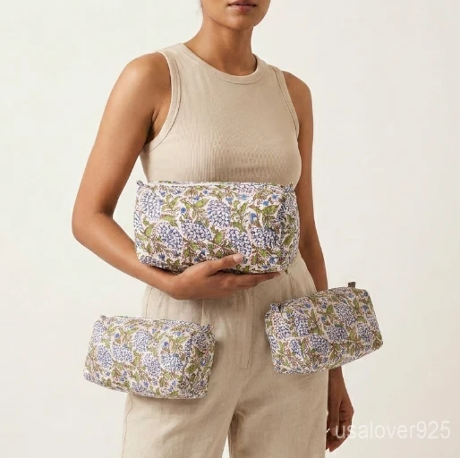 Set of 3 White Floral Quilted Cotton Toiletry Bags nesting set showing the traditional botanical artisan design and secure zipper fastenings.