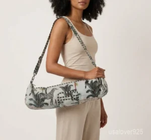 Close-up of the handcrafted white jungle print detailing, dense quilted stitching texture lines, robust adjustable strap attachments, and clean zip track on an Indian cotton Pilates carrier bag.