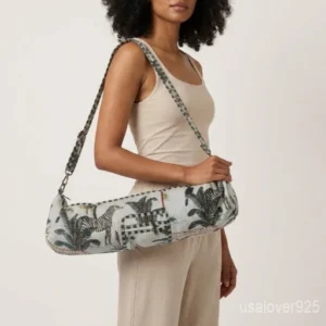 Close-up of the handcrafted white jungle print detailing, dense quilted stitching texture lines, robust adjustable strap attachments, and clean zip track on an Indian cotton Pilates carrier bag.