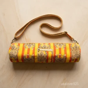 Woman walking to a workout studio carrying a Wild Tiger Striped Quilted Cotton Yoga Mat Bag comfortably as a crossbody sling.