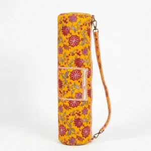 Woman walking to an outdoor workout session carrying a Yellow Floral Cotton Yoga Mat Bag comfortably as a crossbody sling.