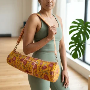 Yellow Floral Cotton Yoga Mat Bag with an adjustable shoulder strap showing the vibrant mustard botanical print.