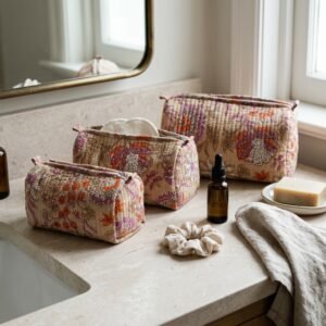 Close-up of the largest case in the Black Beige Floral Quilted Toiletry Bag Set opened to reveal the clean protective interior lining, smooth zipper track, and soft quilted horizontal stitching texture.