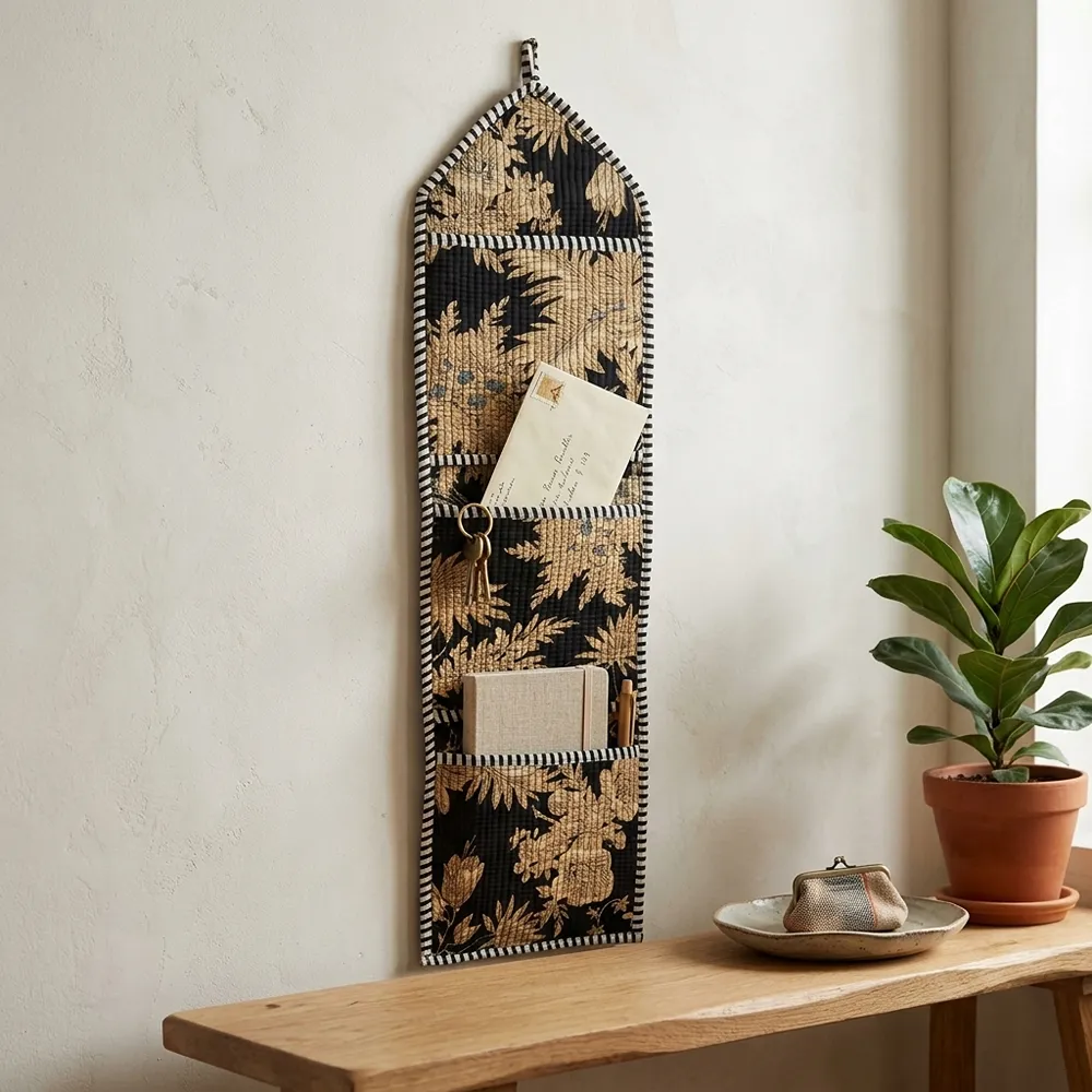 Close-up of the handcrafted vintage botanical print detailing, dense quilted stitching texture lines, robust pocket seam attachments, and clean pocket opening on the cotton pocket storage.