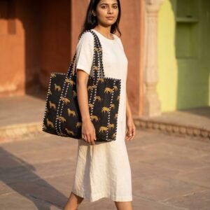 Black Leopard Quilted Tote Bag showing the traditional wild cat hand block print artisan design with the spacious 18x18 main compartment opening and reinforced double padded shoulder handles.