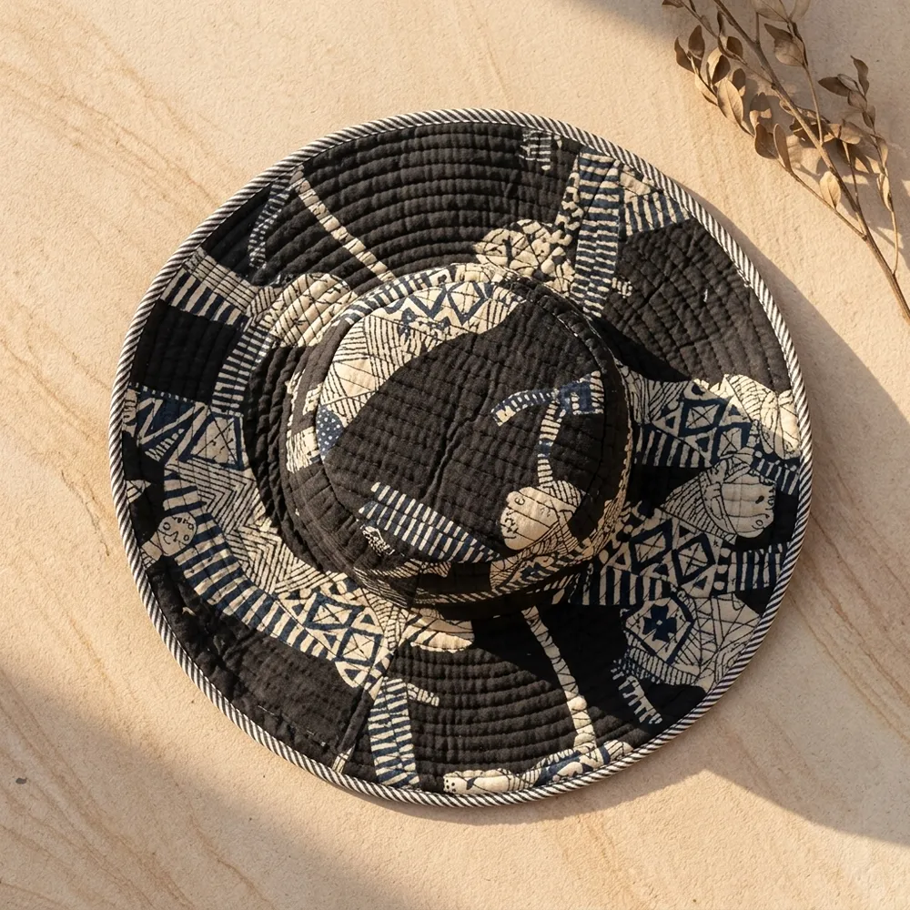 Close-up of the handcrafted black jungle print detailing, dense quilted tracking stitching lines, and neat edge trim on the reversible side of the summer travel headwear.