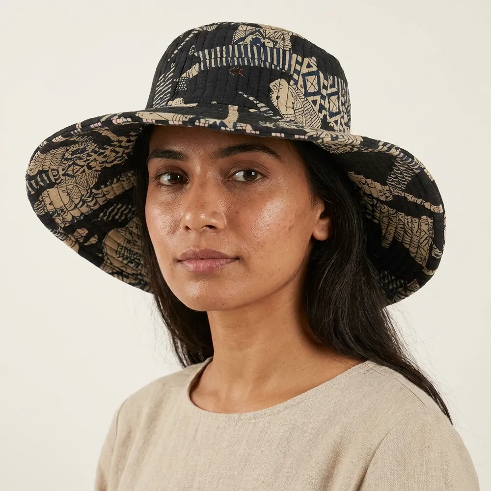 Black Safari Quilted Cotton Sun Hat showing the wide brim bucket cap frame with the handcrafted black wild cat block print detailing.