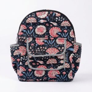 Close-up of the handcrafted blue botanical print detailing, dense quilted stitching texture lines, robust adjustable shoulder straps, and spacious open interior layout on an Indian cotton travel daypack.