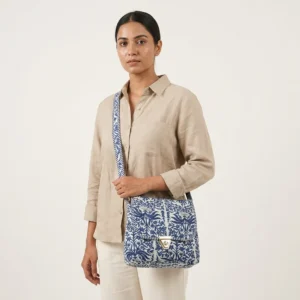 A travel scene featuring a person wearing the quilted cotton sling purse across a linen outfit, highlighting its lightweight everyday carrying convenience and bohemian style.