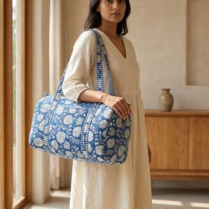 Blue Floral Quilted Duffle Bag showing the traditional hand block print artisan design with the spacious main compartment opening and reinforced double carry handles.
