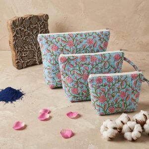 Close-up of the handcrafted blue botanical print detailing, dense quilted stitching texture lines, robust zipper closure, and spacious inner layout on the large cotton toiletry pouch.