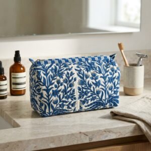 Blue Indigo Quilted Toiletry Bag Set showing the nested 3-piece handmade travel pouch bundle with the traditional blue and white artisan block print design and secure zipper tracks.