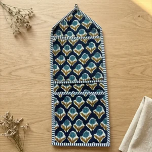 Close-up of the handcrafted indigo geometric print detailing, dense quilted stitching texture lines, robust pocket seam attachments, and clean pocket opening on the cotton pocket storage.