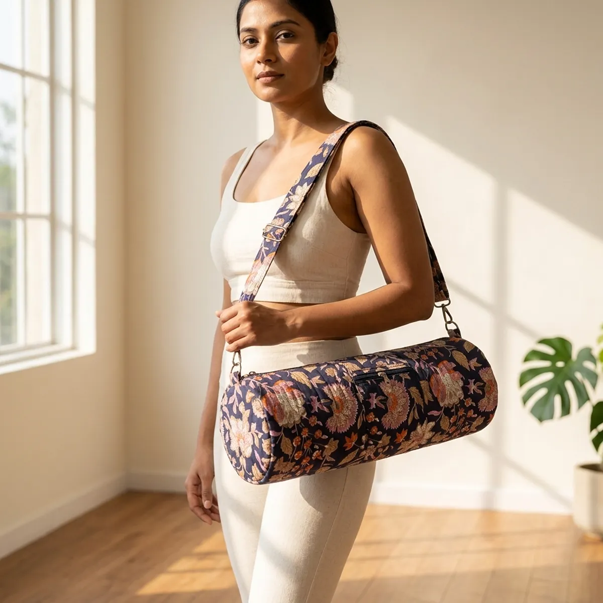 Blue Kalamkari Quilted Cotton Yoga Mat Bag showing the cylindrical crossbody carrier design with the handcrafted ethnic block print pattern and full-length zipper closure.