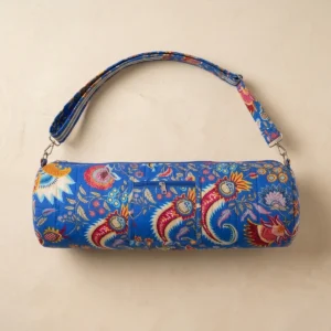 Close-up of the handcrafted multicolored floral detailing, dense quilted tracking lines, robust zipper attachment, and durable cross-stitched shoulder strap joints on the fitness tote.