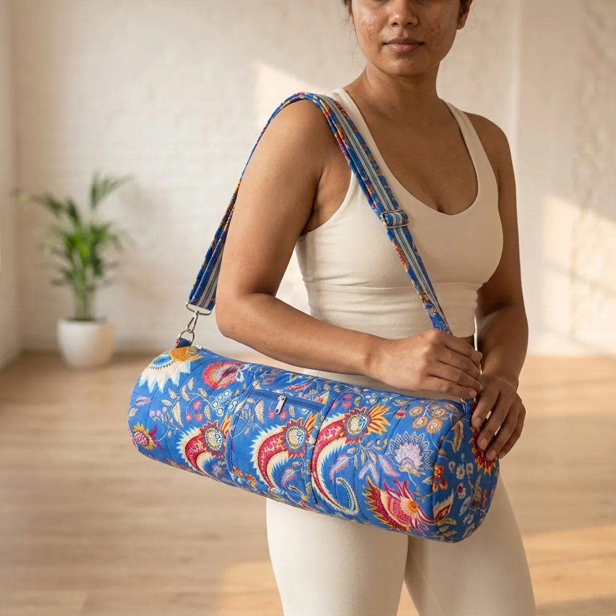 Blue Kalamkari Quilted Cotton Yoga Mat Bag showing the cylindrical crossbody carrier design with the handcrafted ethnic block print pattern and full-length zipper closure.