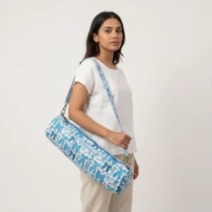 Close-up of the handcrafted white striped block print detailing, dense quilted tracking lines, robust zipper attachment, and durable cross-stitched shoulder strap joints on the fitness tote.