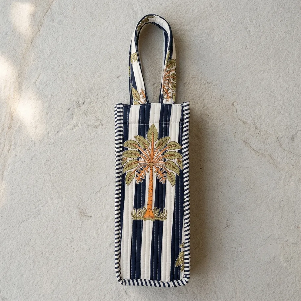 Close-up of the handcrafted blue stripe block print detailing, dense quilted tracking lines, and reinforced handle base joints on the cotton wine holder.