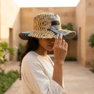 Blue Tiger Quilted Cotton Sun Hat showing the wide brim bucket cap frame with the handcrafted blue wild cat block print detailing.